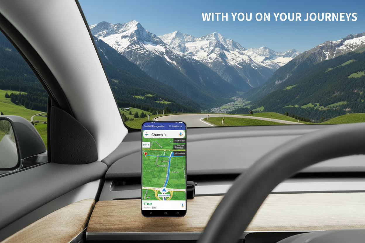 A smartphone mounted on a dashboard holder inside a car, displaying a navigation app screen. The phone is positioned on a wood-grain dashboard with a steering wheel in the foreground and a bridge view through the windshield. TESLA_MODEL_3_MODEL_Y_SUPER_MAGNET_DASH_PHONE_MOUNT_WITH_PRONGS_BUY_FROM_IRELAND_AND_EUROPES_TESLARY.EU