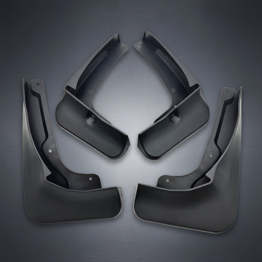 Four black plastic vehicle mud flaps arranged symmetrically on a plain white background.