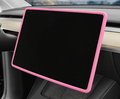 A pink protective bumper case fitted around a large black car infotainment touchscreen display, shown installed inside a vehicle interior. TESLA_MODEL_Y_JUNIPER_TESLA_MODEL_3_HIGHLAND_16_SCREEN_YL_SCREEN_SILICONE_EDGE_PROTECTOR_BLACK_GREY_WHITE_BUY_FROM_IRELAND_AND_EUROPES_TESLARY.EU_TESLARY.FI_TESLARY.SE_TESLARY.ES_TESLARY.PT_TESLARY.CO.UK_TESLARY.IE