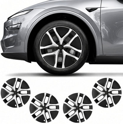 Four black and silver multi-spoke wheel covers shown below a cropped side view of a gray SUV wheel, on a white background. TESLA_MODEL_JUNIPER_19_WHEEL_PERFORMANCE_PREMIUM_ARACHNID_BUY_FROM_THE_TESLA_ACCESSORIES_SPECIALISTS_WITH_FREE_DELIVERY_ACROSS_EUROPE_TESLARY.EU_TESLARY.PT_TESLARY.ES