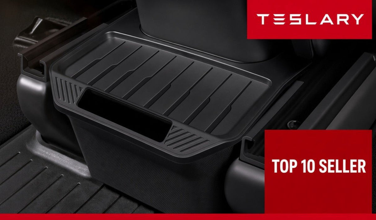 A black Tesla floor mat liner shown installed inside a vehicle cabin, with red promotional text overlays reading TESLARY and TOP 10 SELLER. TESLA_MODEL_Y_MODEL_Y_JUNIPER_REAR_STORAGE_BIN_BUY_FROM_EUROPE_AND_IRELAND_TESLARY.EU_TESLARY.IE_TESLARY.CO.UK_TESLARY.PT_TESLARY.ES TESLA_MODEL_Y_MODEL_Y_JUNIPER_REAR_STORAGE_BIN_BUY_FROM_EUROPE_AND_IRELAND_TESLARY.EU_TESLARY.IE_TESLARY.CO.UK_TESLARY.PT_TESLARY.ES