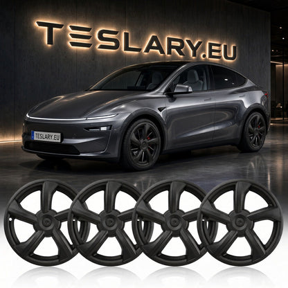 Four matte black multi-spoke wheel covers displayed in a row, with a dark gray Tesla Model Y in the background in front of a lit TESLARY.EU sign. Tesla Model Y Juniper 19 inch Wheel Covers Hub Caps Matte Black Free Delivery with Fedex Buy from Ireland and Europes Teslary.eu