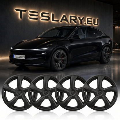 Four matte black multi-spoke wheel covers displayed in a row, with a black Tesla Model Y in the background in front of a Tesla wall sign. Tesla Model Y Juniper 19 inch Wheel Covers Hub Caps Matte Black Free Delivery with Fedex Buy from Ireland and Europes Teslary.eu